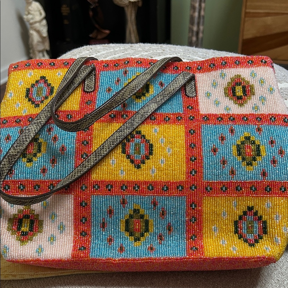Fendi beaded tote bag with zipper closure.